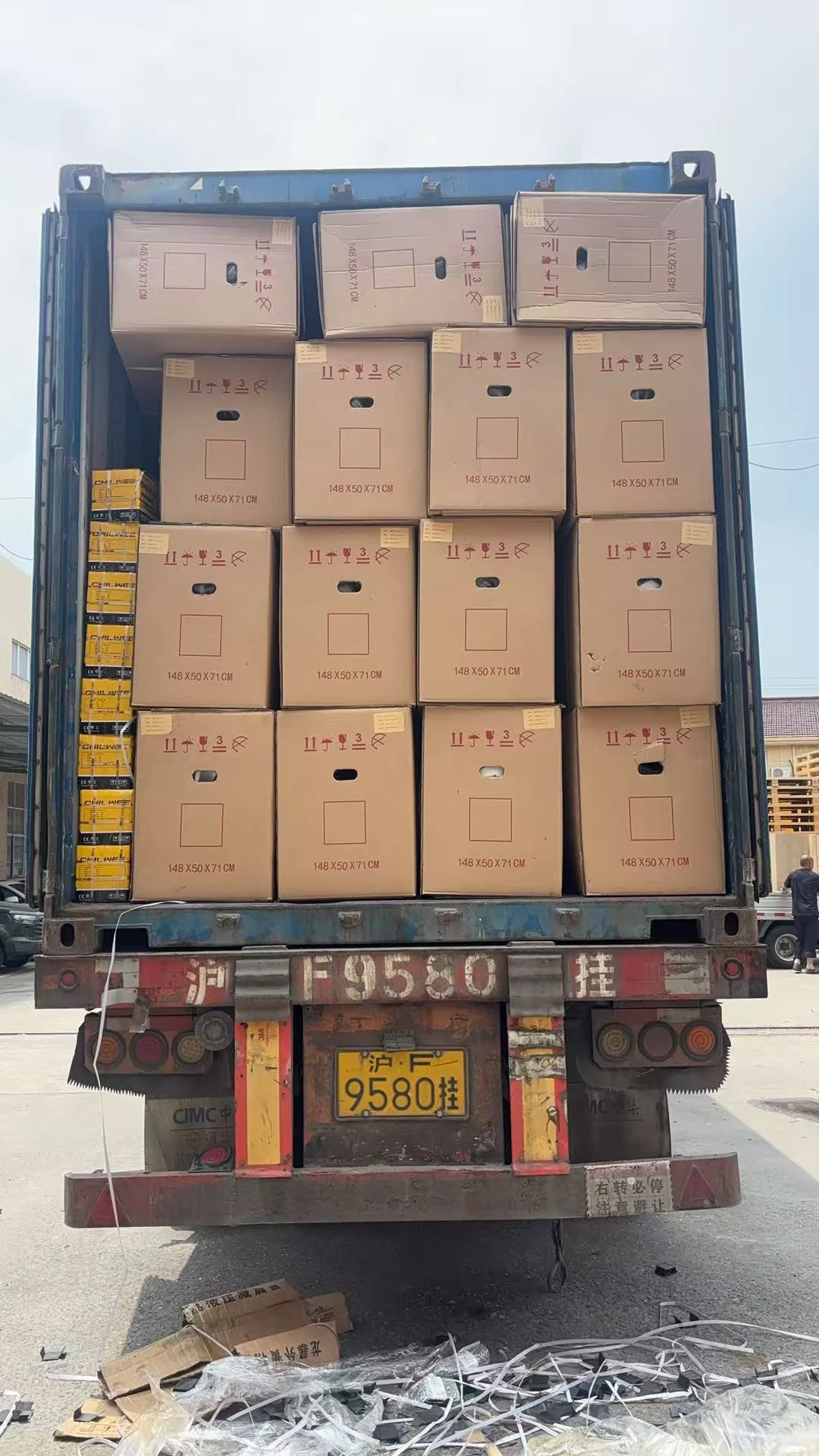 Packed cartons arranged inside a container during loading preparation